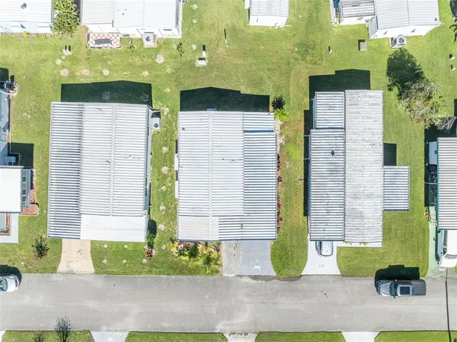 a view of multiple houses with yard