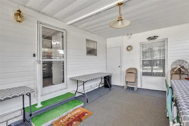 a kitchen with stainless steel appliances granite countertop a sink refrigerator stove and microwave