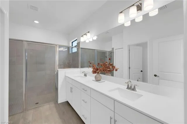 a bathroom with a glass shower door