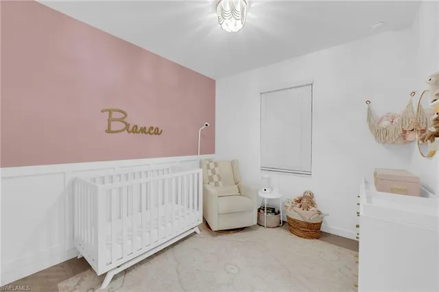 an empty room with a ceiling fan and a window