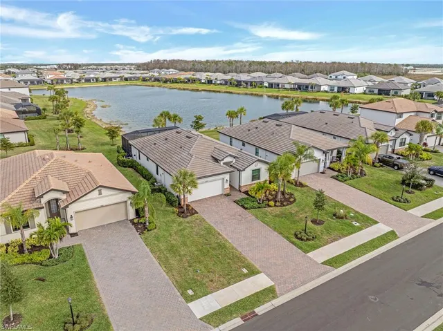 a view of a dining room with furniture wooden floor and a chandelier