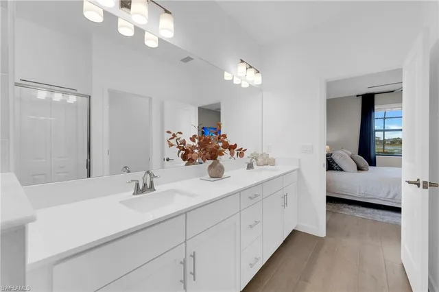 a view of a swimming pool with lawn chairs