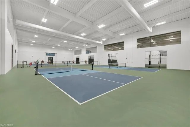 a view of a kitchen with a sink and a fireplace