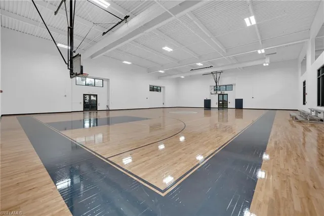 a view of a room with lots of gym equipment
