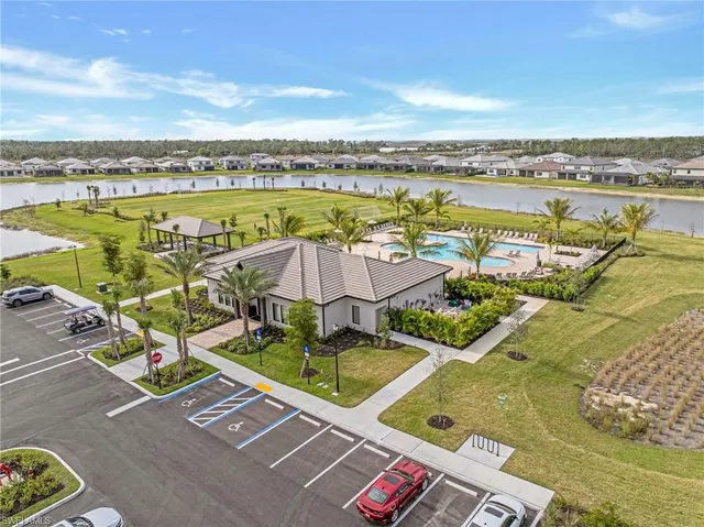 a view of a swimming pool and an outdoor seating