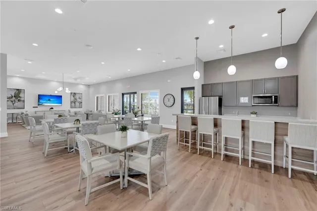 a view of a ocean with couches and city view