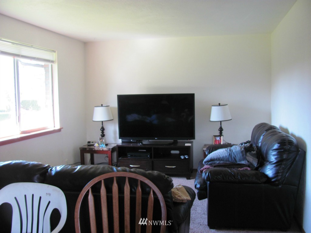 10804 Davisson Road Southwest Lakewood, WA 98499 - Photo 3 of 15 a living room with furniture and a flat screen tv