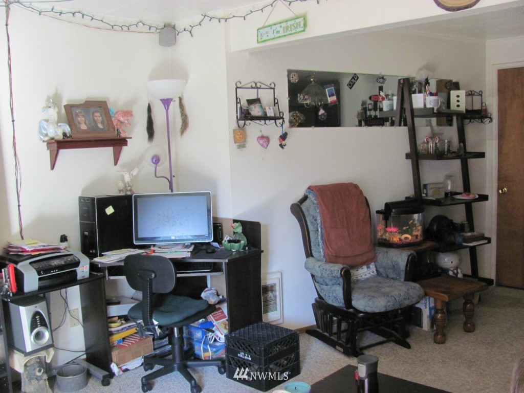 10804 Davisson Road Southwest Lakewood, WA 98499 - Photo 9 of 15 a view of a workspace with furniture and toys