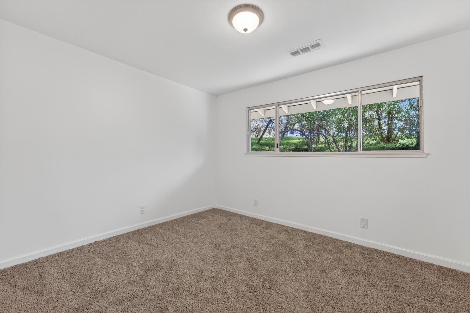 8040 Gilardi Road Newcastle, CA 95658 - Photo 11 of 23 an empty room with a window