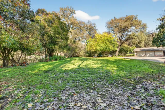 a view of outdoor space with deck and garden