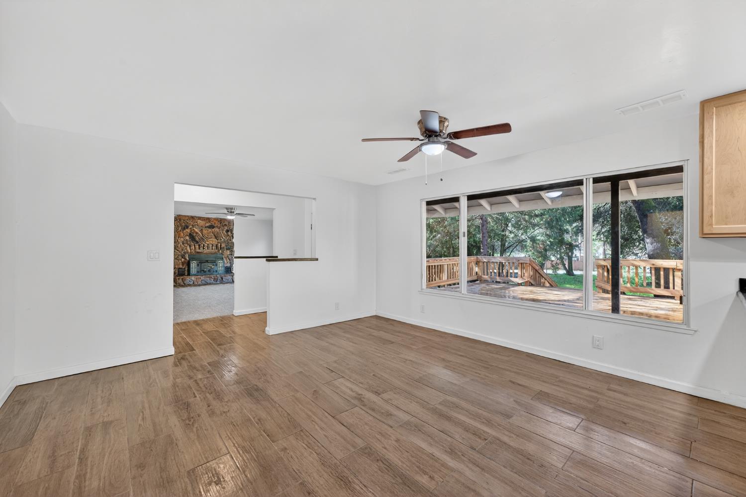 8040 Gilardi Road Newcastle, CA 95658 - Photo 7 of 23 a view of empty room with wooden floor and fan
