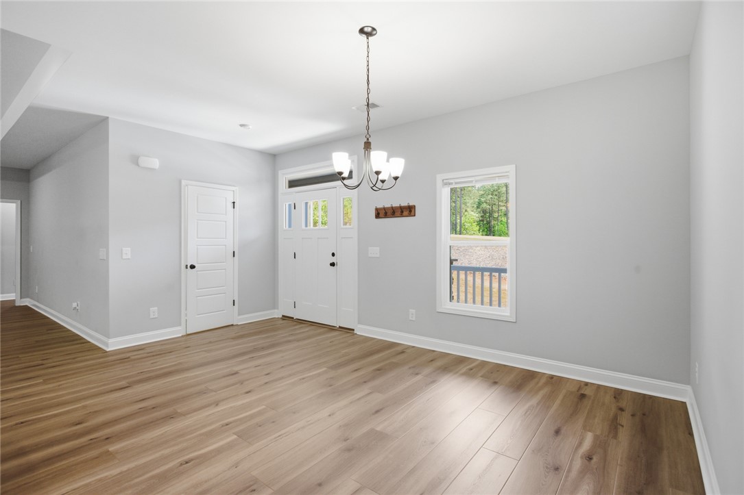 912 Watercrest Road West Union, SC 29696 - Photo 12 of 49 This bright entrance and living area features warm wood flooring and ample natural light.