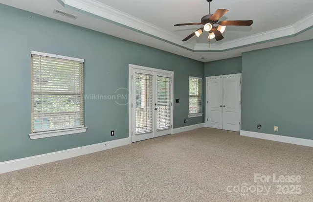 a view of empty room with windows