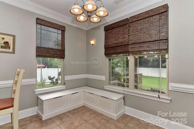 a bathroom with a tub and a large window