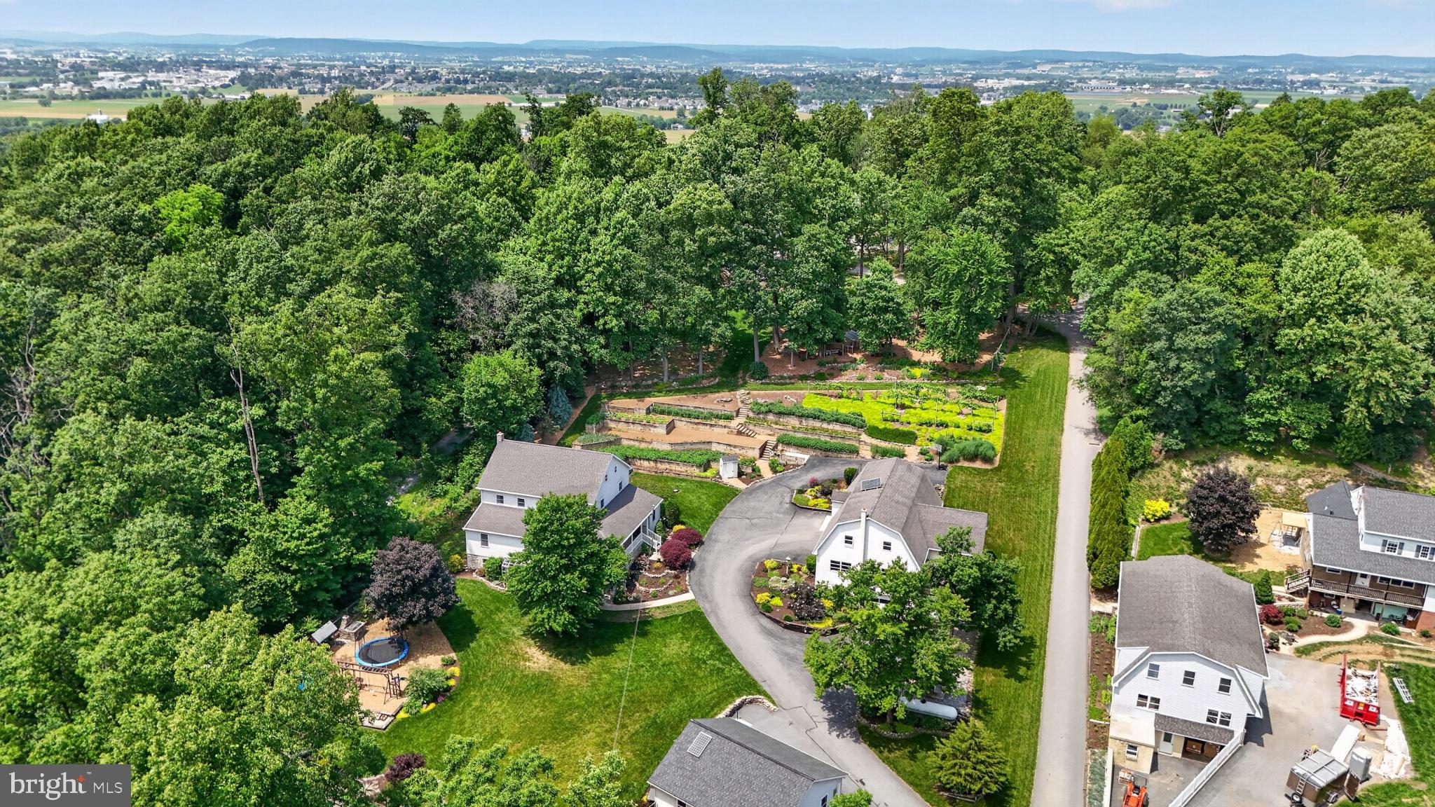 257 Hill Road New Holland, PA 17557 - Photo 11 of 94 Serene suburban retreat in lush greenery.