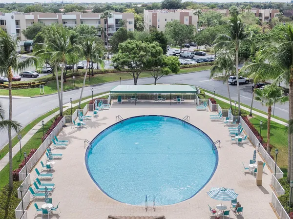 an aerial view of a house with a swimming pool