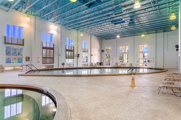 a view of a swimming pool with a lake view