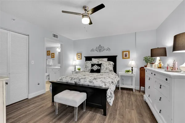 a bedroom with a bed and a dresser in it