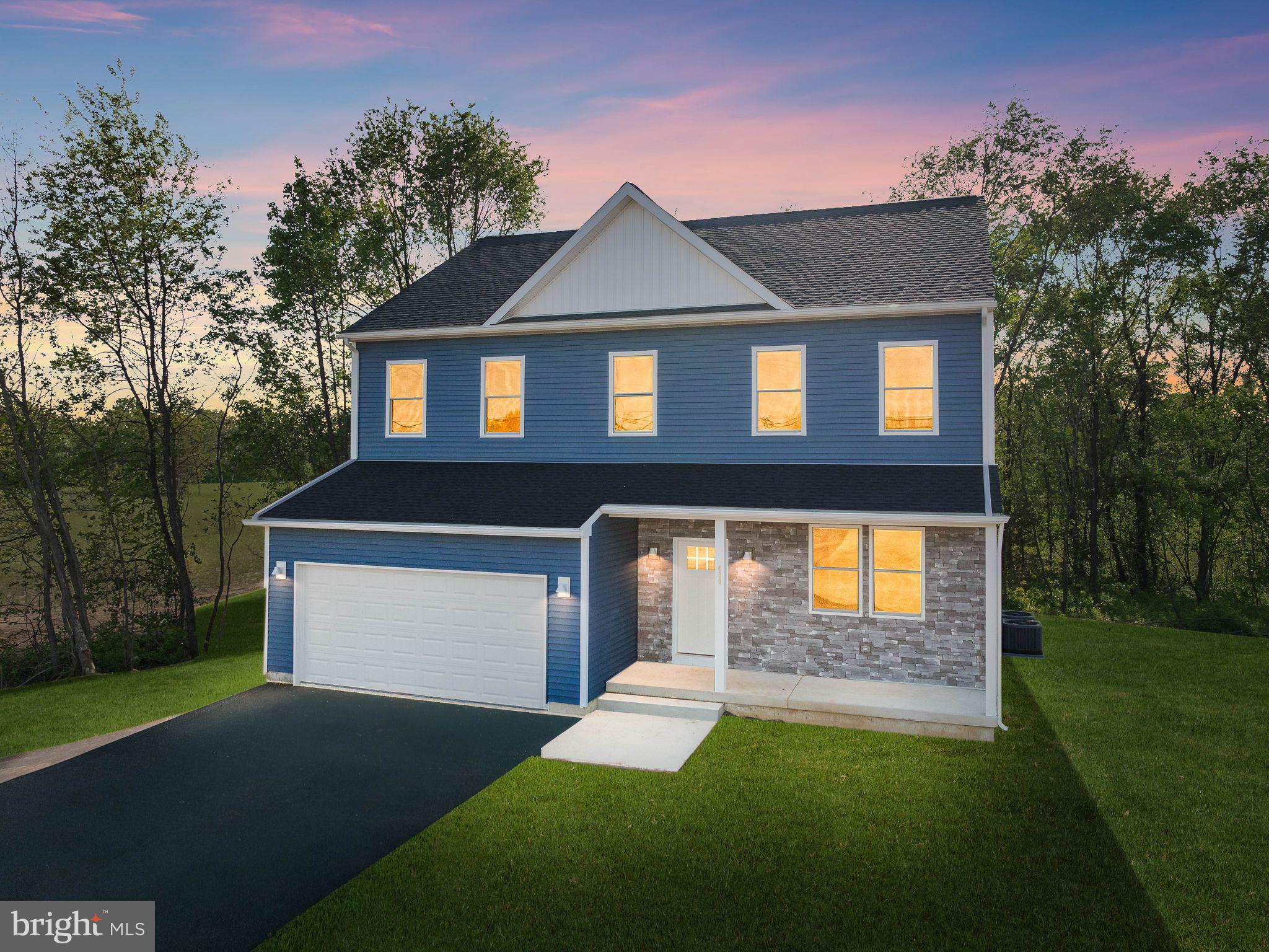 Charming blue home at twilight glow.