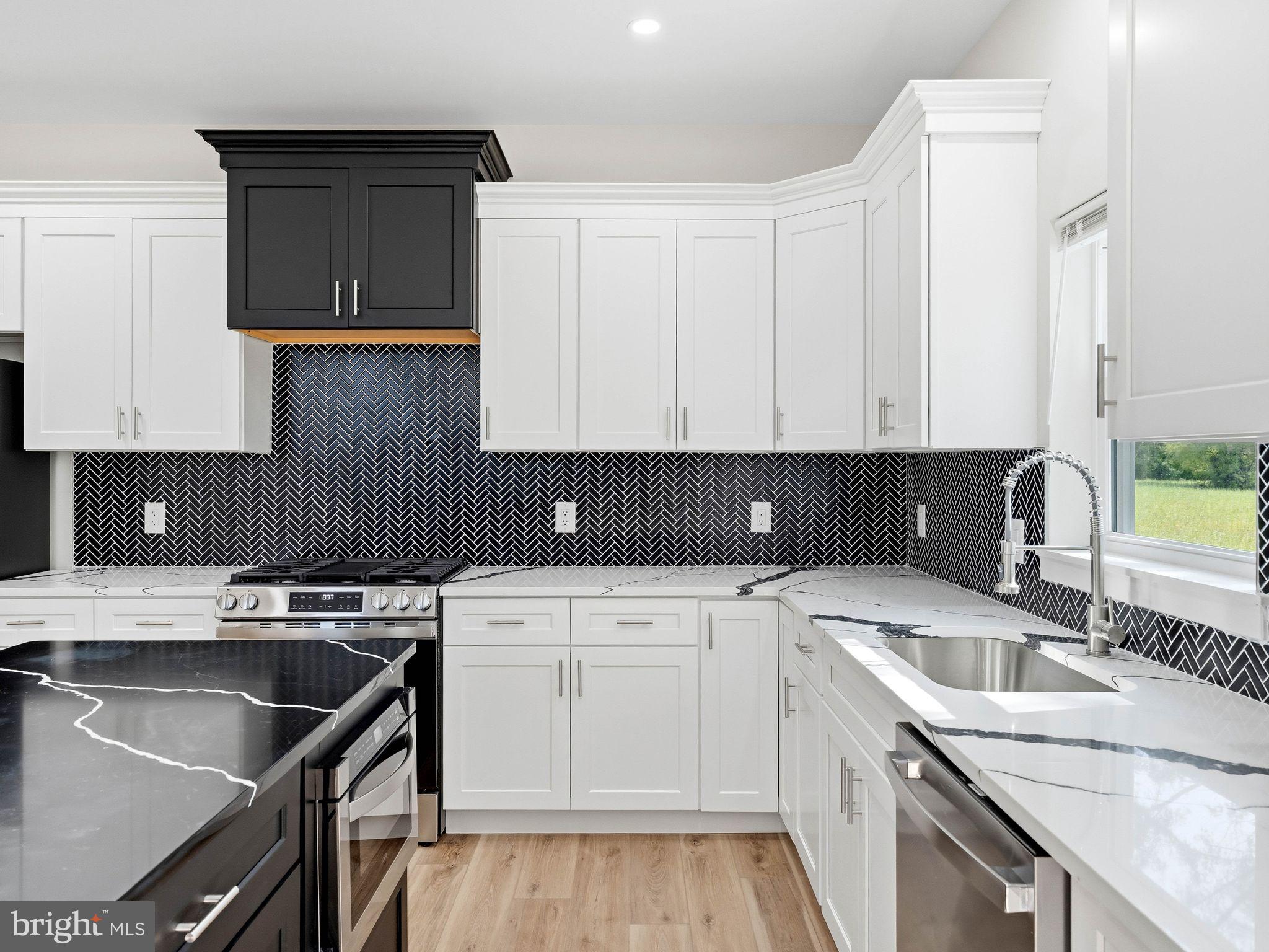 400 Paulsboro Road Swedesboro, NJ 08085 - Photo 17 of 54 Sleek modern kitchen with bold contrasts.