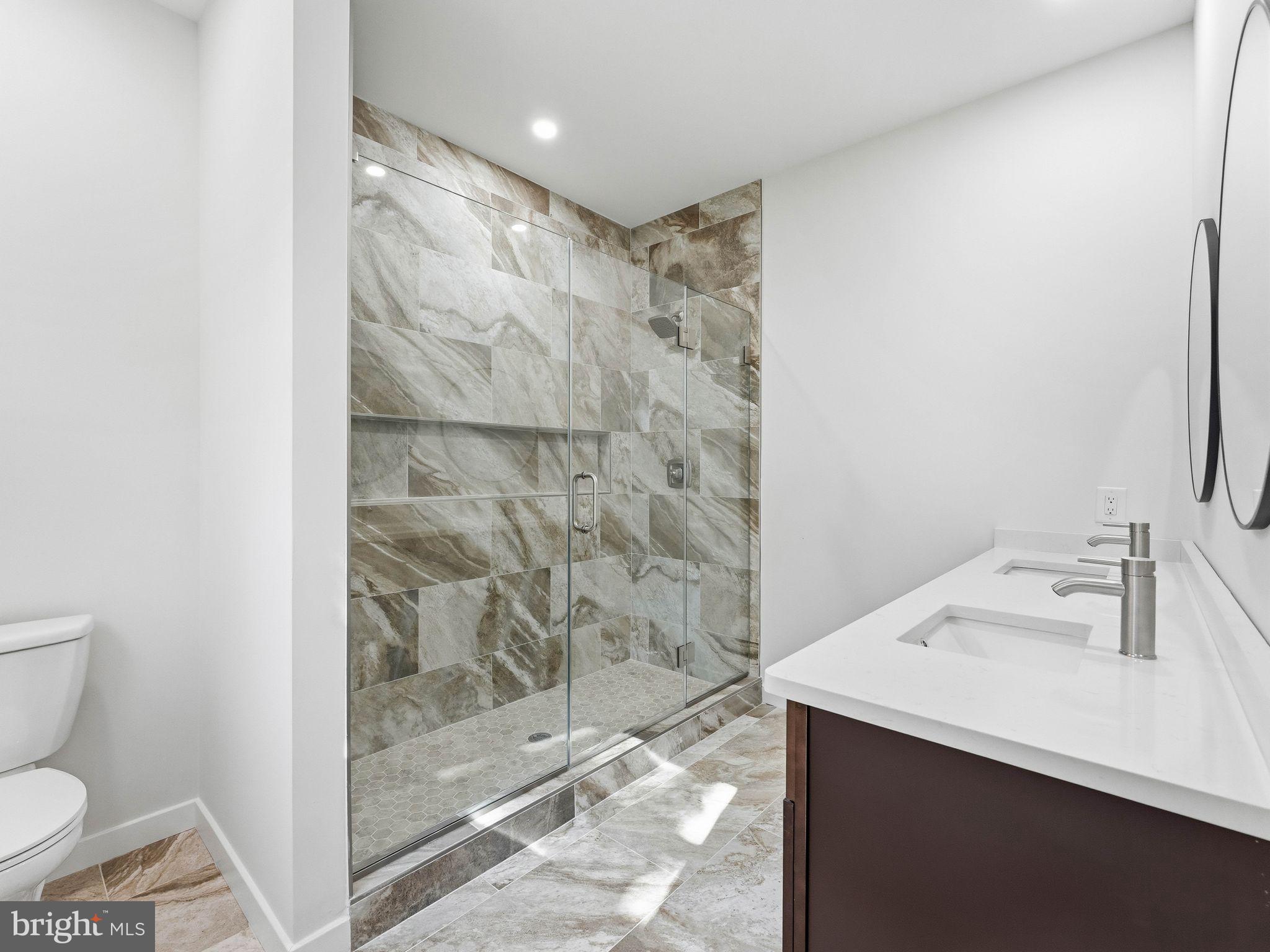400 Paulsboro Road Swedesboro, NJ 08085 - Photo 27 of 54 Sleek modern bathroom with elegant tiles.