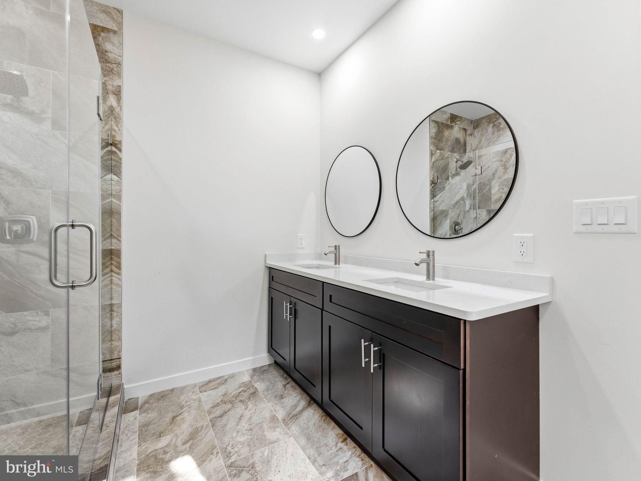 400 Paulsboro Road Swedesboro, NJ 08085 - Photo 28 of 54 Sleek modern bathroom with dual sinks.