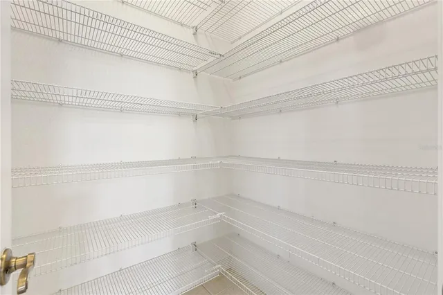 a view of a kitchen with microwave and cabinets