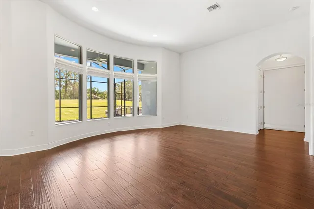 a bathroom with a bathtub and mirror