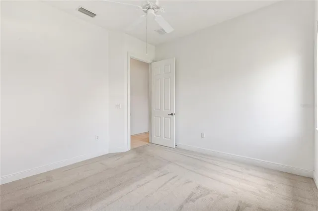 a bathroom with a sink a toilet and a window