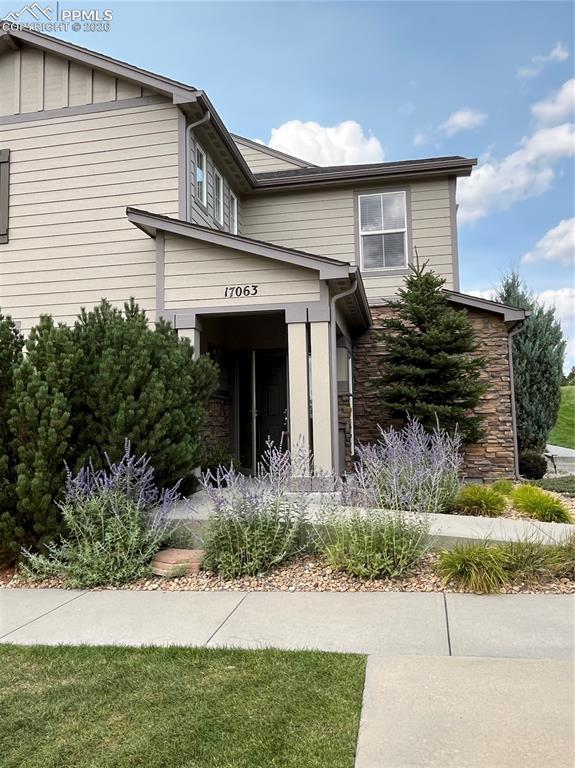 17063 Blue Mist Grove Monument, CO 80132 - Photo 28 of 33 a view of a house with a yard