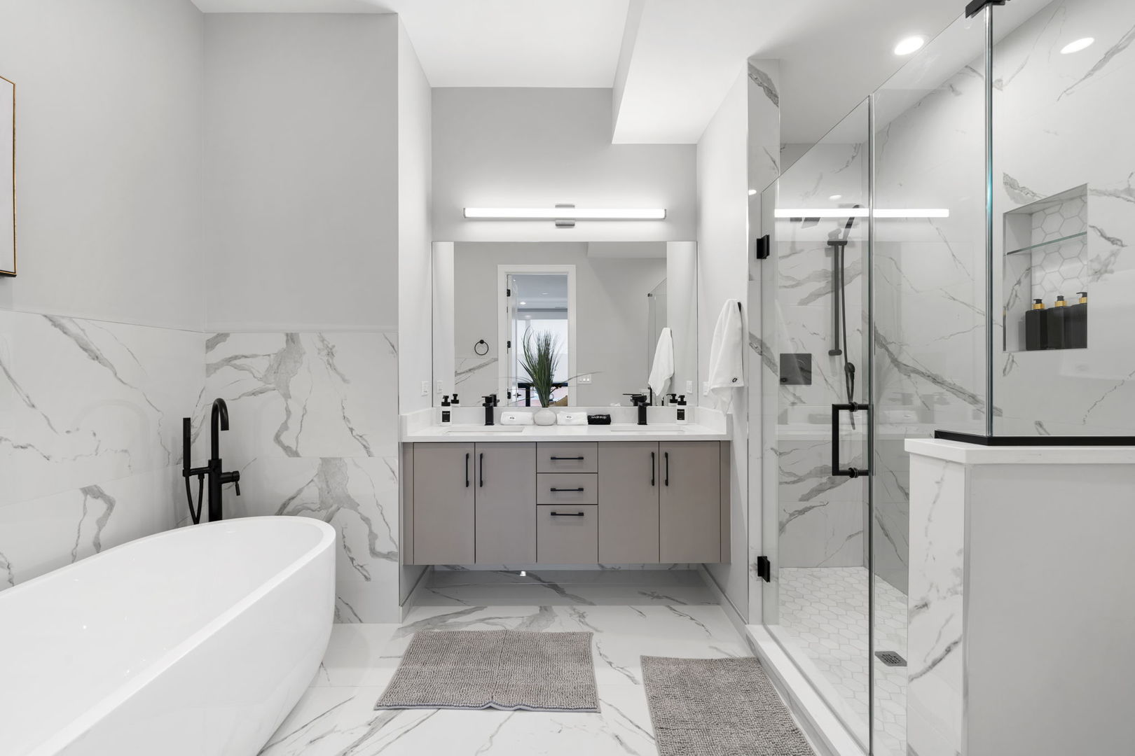 1606 South Ashland Avenue, Unit 401 Chicago, IL 60608 - Photo 12 of 25 a bathroom with a tub sink and mirror