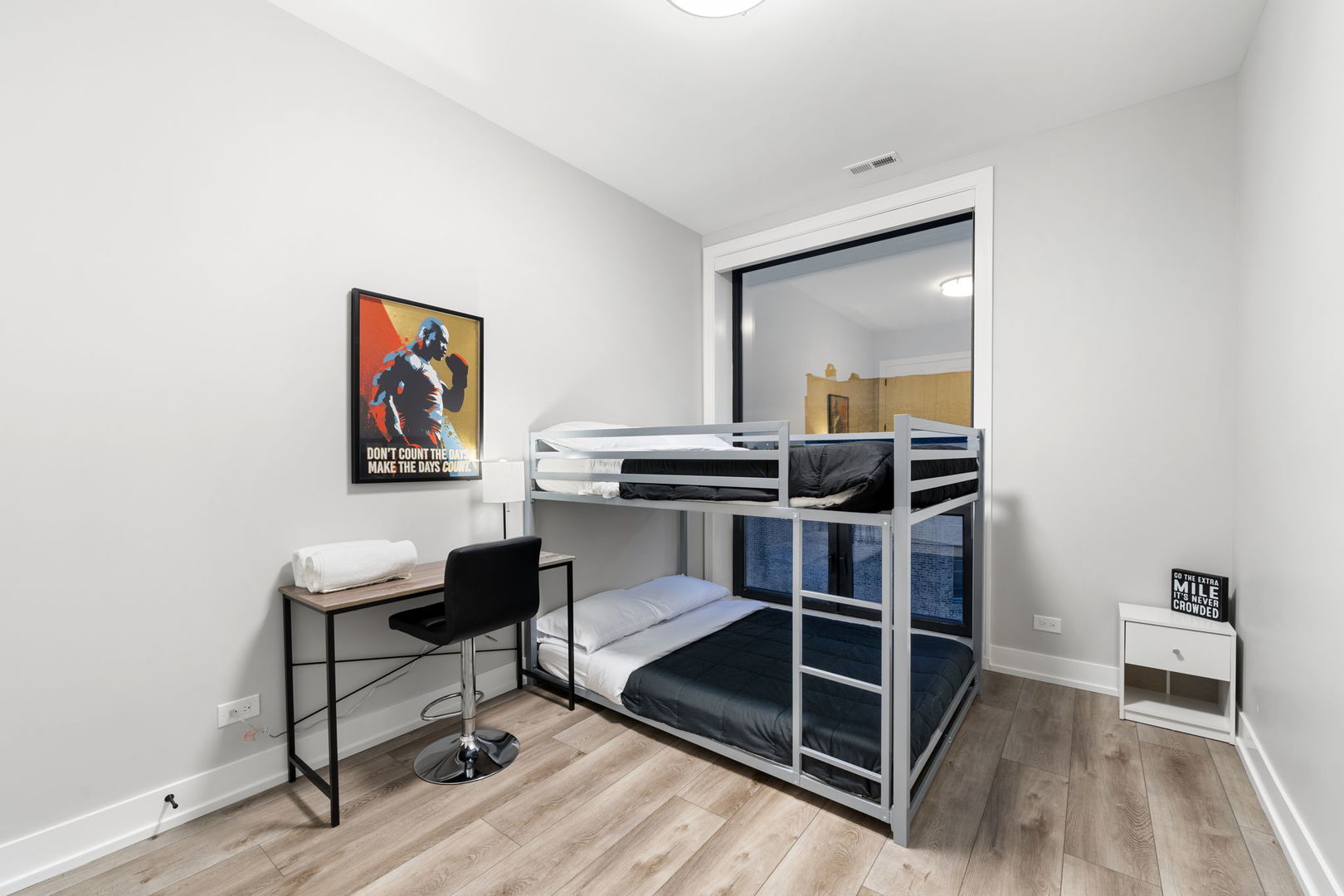 1606 South Ashland Avenue, Unit 401 Chicago, IL 60608 - Photo 19 of 25 a view of a room with wooden floor and furniture