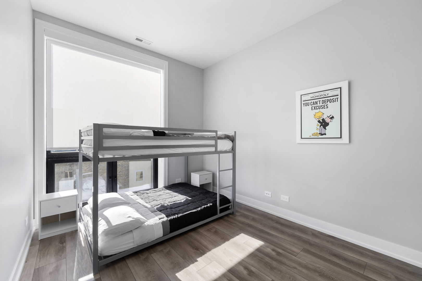 1606 South Ashland Avenue, Unit 401 Chicago, IL 60608 - Photo 20 of 25 a bedroom with a bed and a window