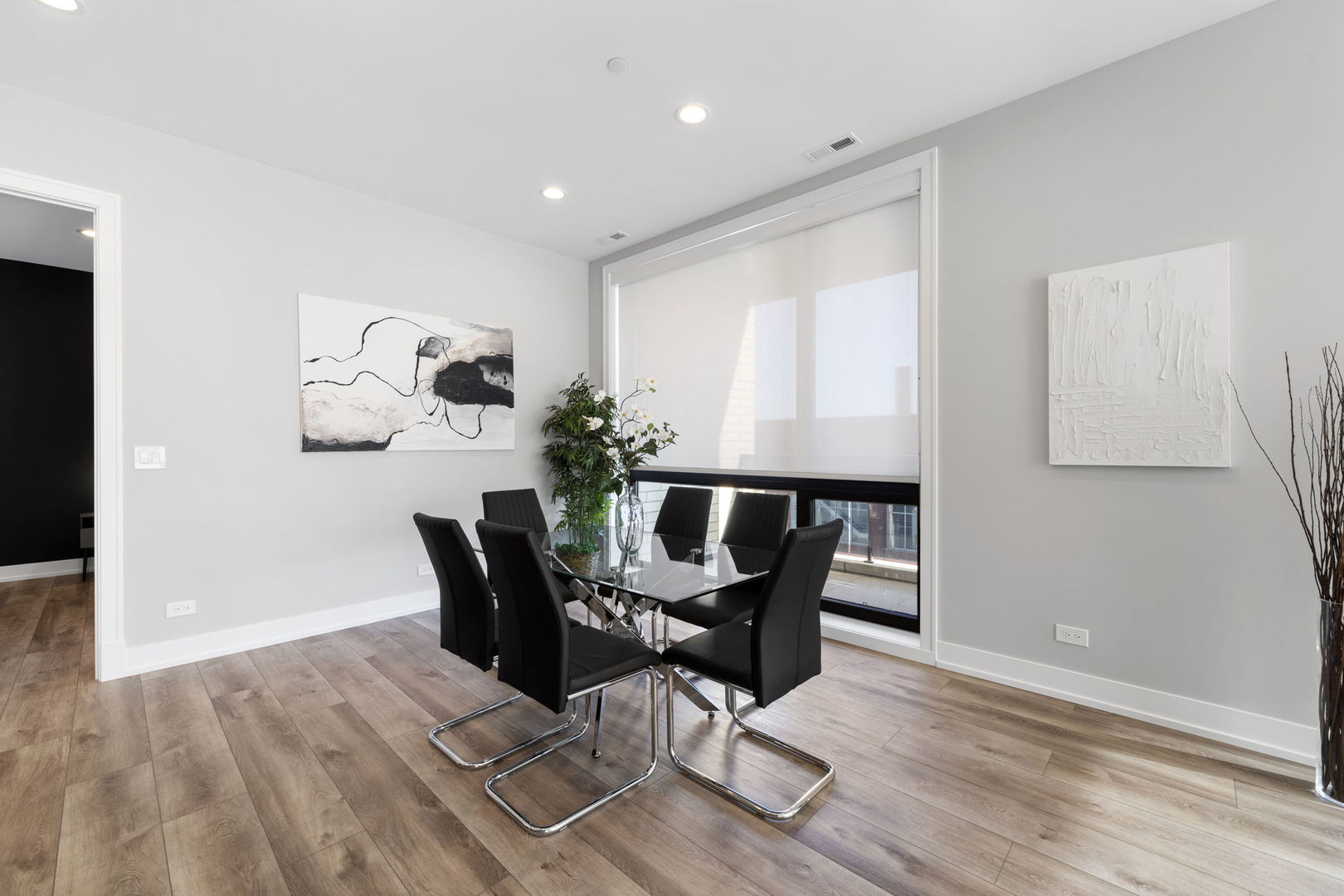 1606 South Ashland Avenue, Unit 401 Chicago, IL 60608 - Photo 6 of 25 a view of a dining room with furniture and wooden floor