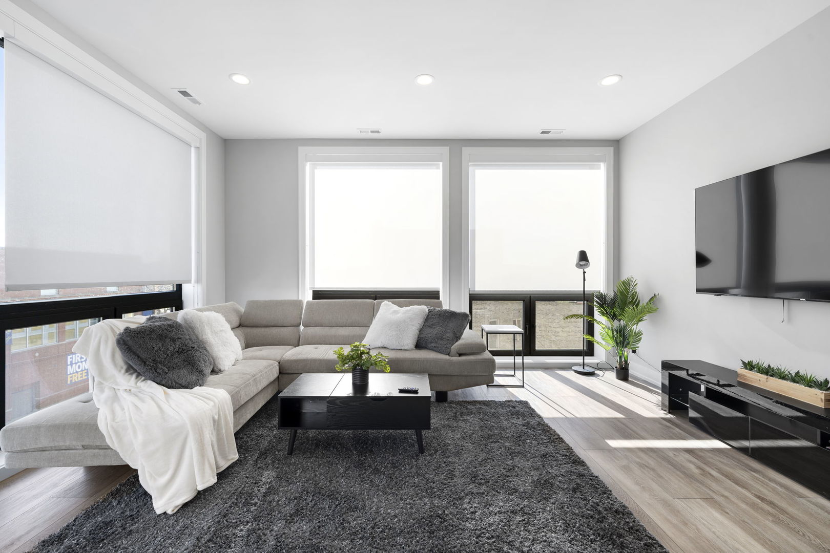 1606 South Ashland Avenue, Unit 401 Chicago, IL 60608 - Photo 9 of 25 a living room with furniture and a flat screen tv