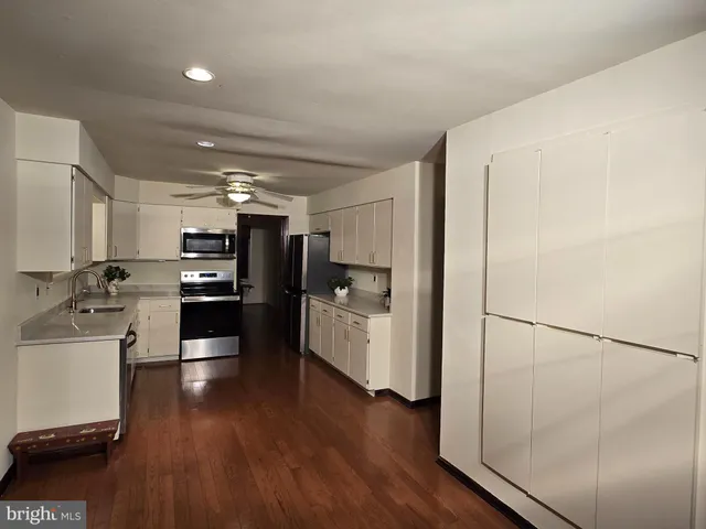 a view of an empty room with a large window