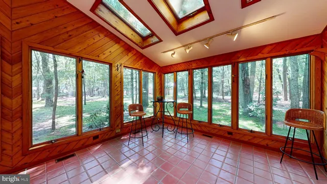 a bathroom with a toilet a sink and a mirror