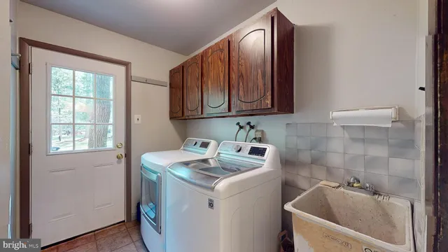 a spacious bedroom with a bed and wooden floor
