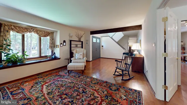 a living room with furniture and a rug