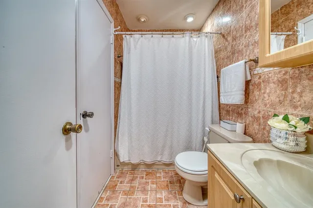 a bedroom with two beds and a window