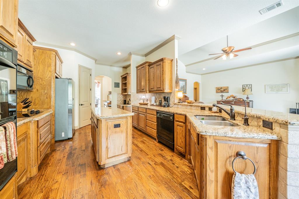 109 Overton Ridge Circle Weatherford, TX 76088 - Photo 8 of 27 Custom wood cabinets and granite counter tops..