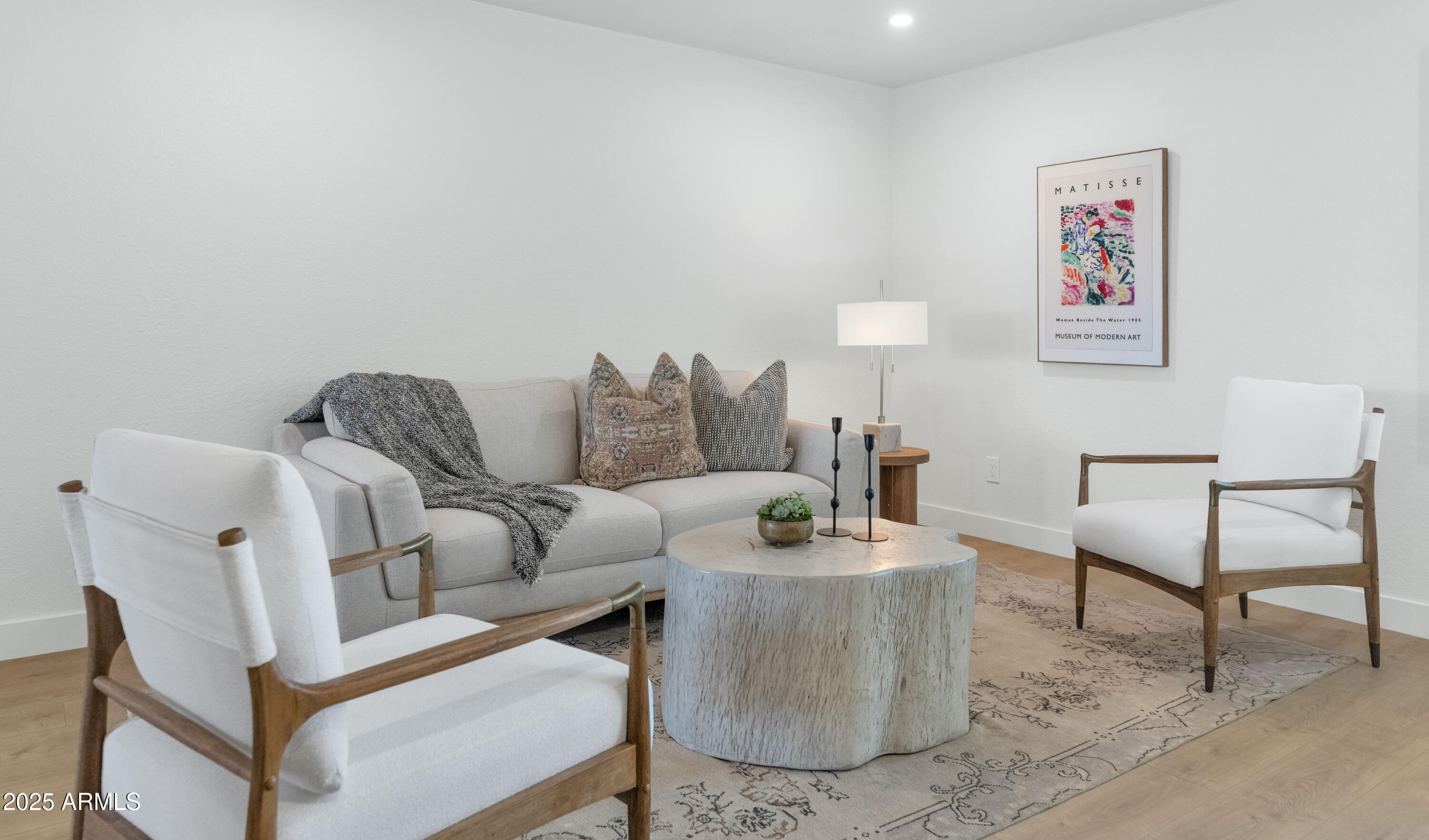 4201 East Camelback Road, Unit 70 Phoenix, AZ 85018 - Photo 11 of 36 a living room with furniture and a couch