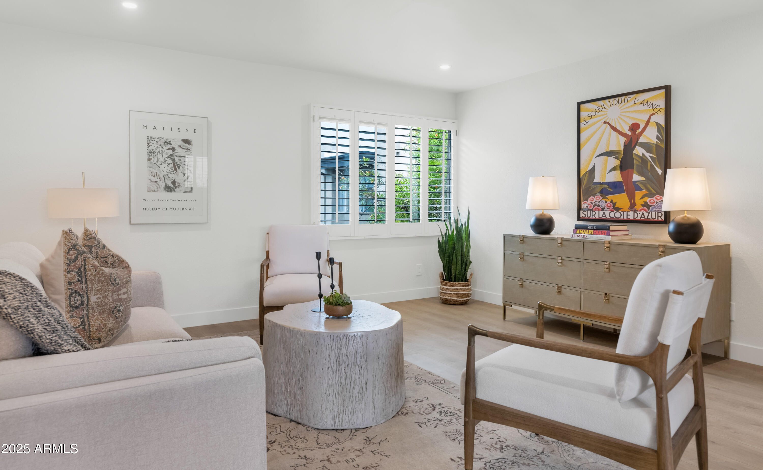 4201 East Camelback Road, Unit 70 Phoenix, AZ 85018 - Photo 15 of 36 a living room with furniture and a potted plant