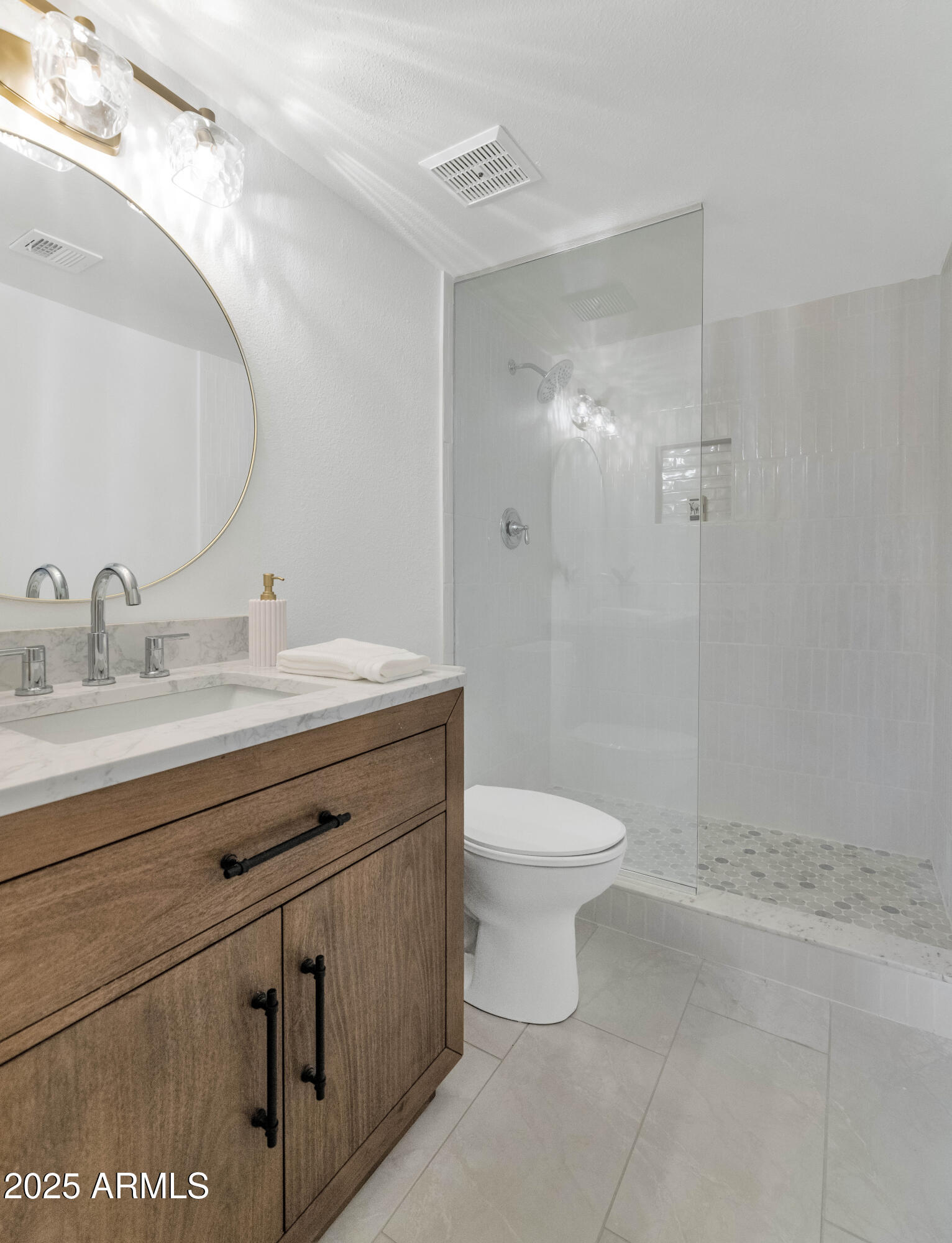 4201 East Camelback Road, Unit 70 Phoenix, AZ 85018 - Photo 24 of 36 a bathroom with a sink a toilet and shower