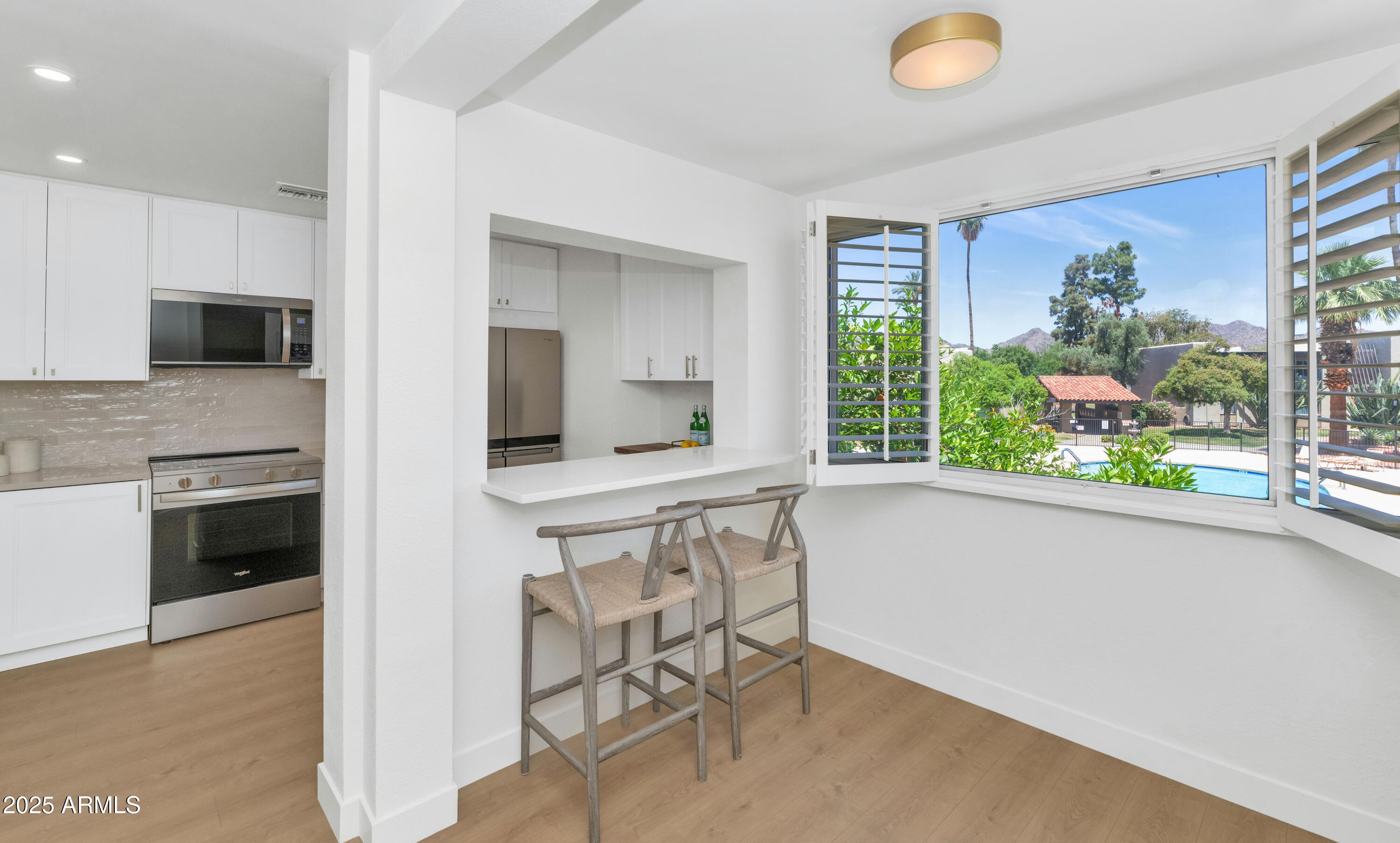 4201 East Camelback Road, Unit 70 Phoenix, AZ 85018 - Photo 3 of 36 a kitchen with a sink cabinets and window