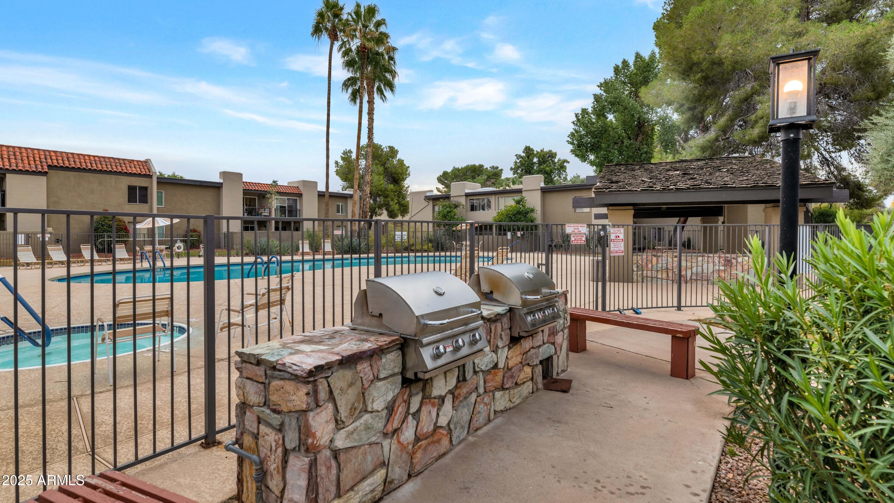 4201 East Camelback Road, Unit 70 Phoenix, AZ 85018 - Photo 31 of 36 a view of roof deck with patio
