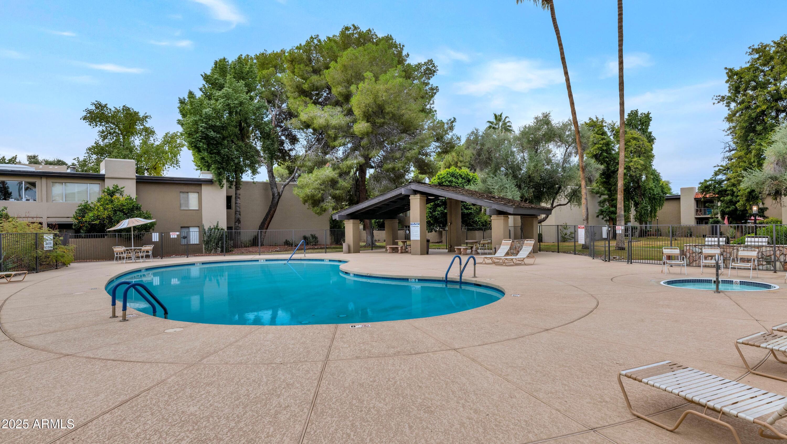 4201 East Camelback Road, Unit 70 Phoenix, AZ 85018 - Photo 34 of 36 a view of outdoor space yard swimming pool and patio