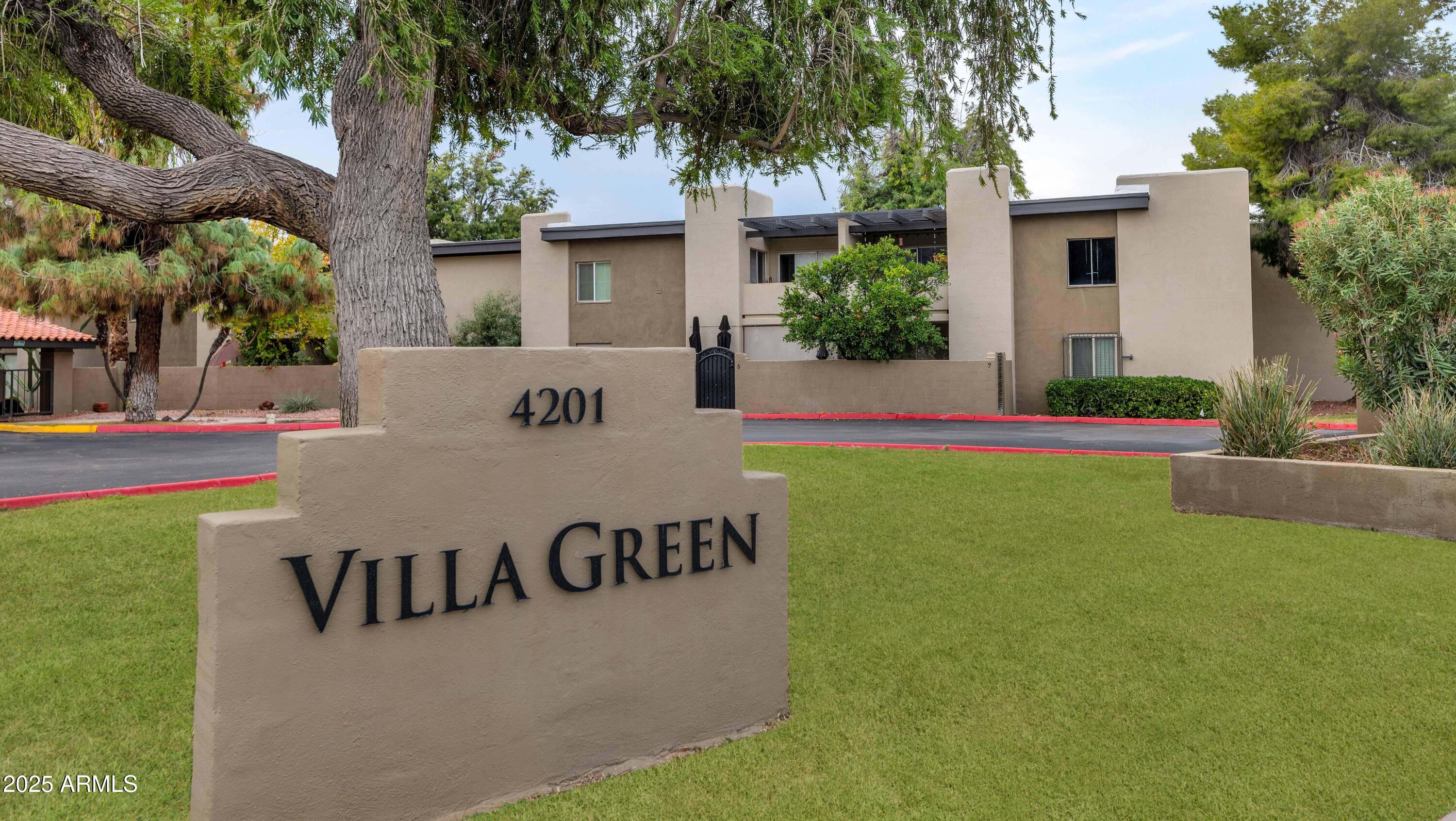 4201 East Camelback Road, Unit 70 Phoenix, AZ 85018 - Photo 35 of 36 a view of a house with a yard