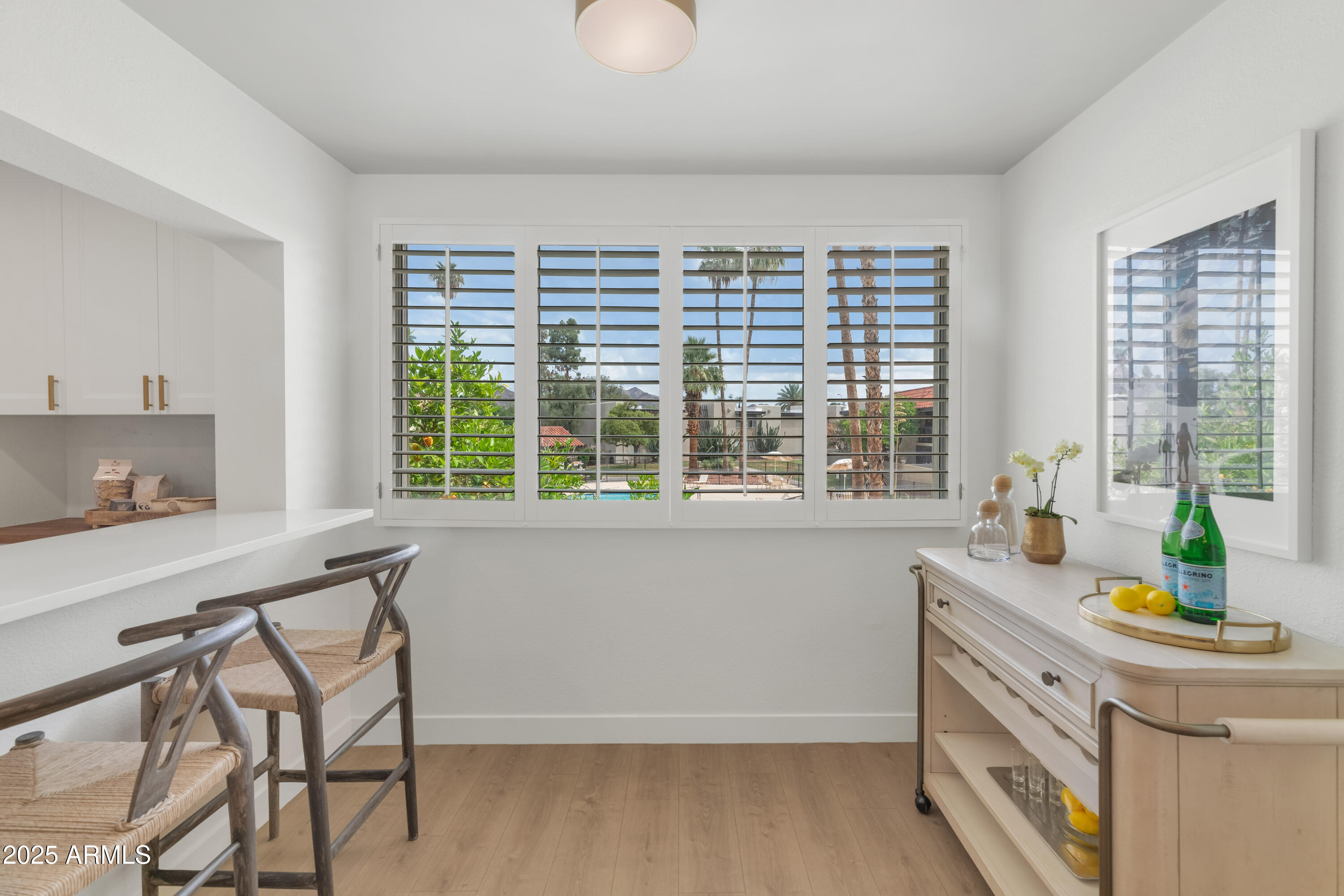 4201 East Camelback Road, Unit 70 Phoenix, AZ 85018 - Photo 6 of 36 a spacious bathroom with a granite countertop sink and a large window