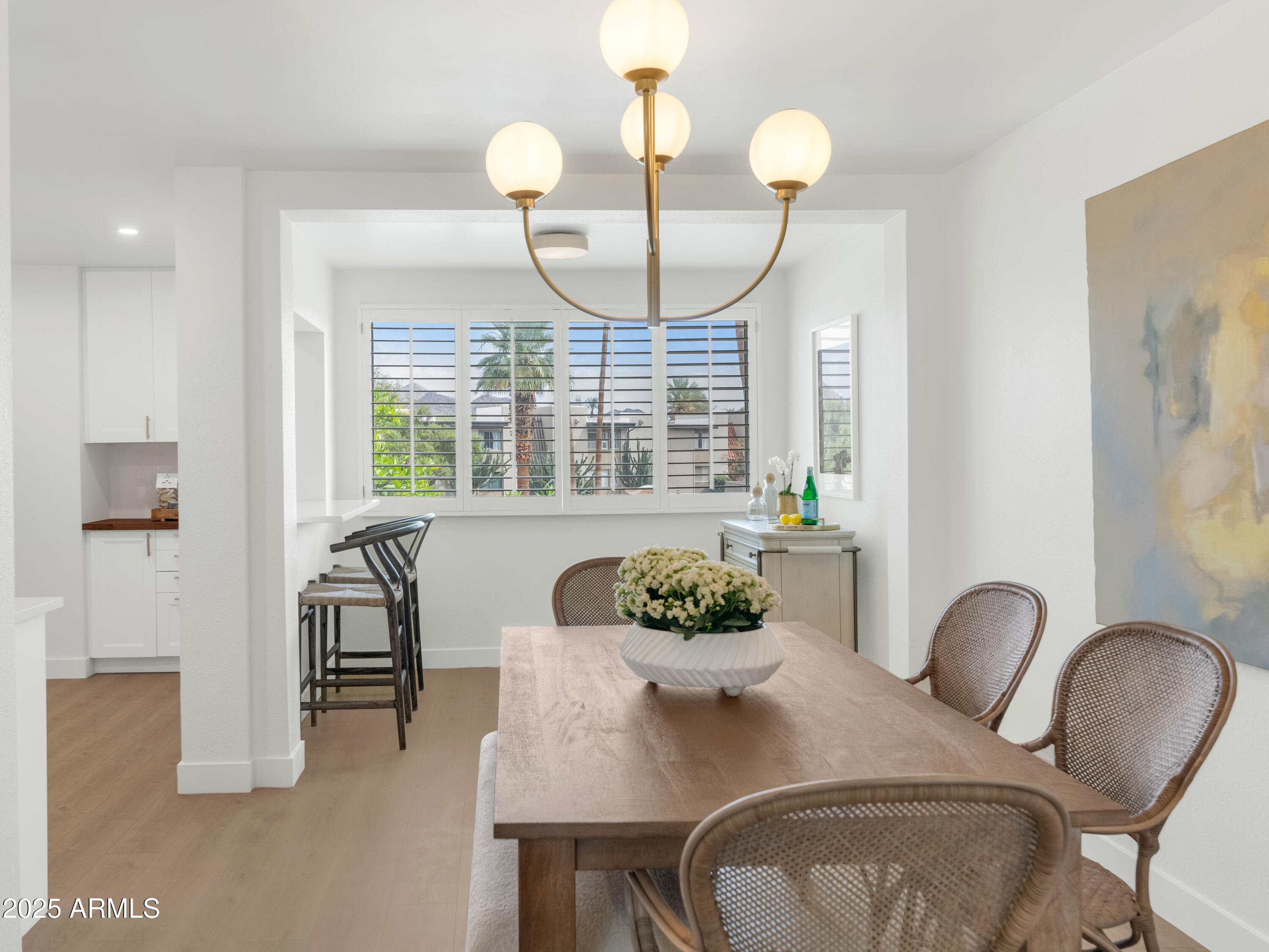 4201 East Camelback Road, Unit 70 Phoenix, AZ 85018 - Photo 9 of 36 a dining room with furniture and window